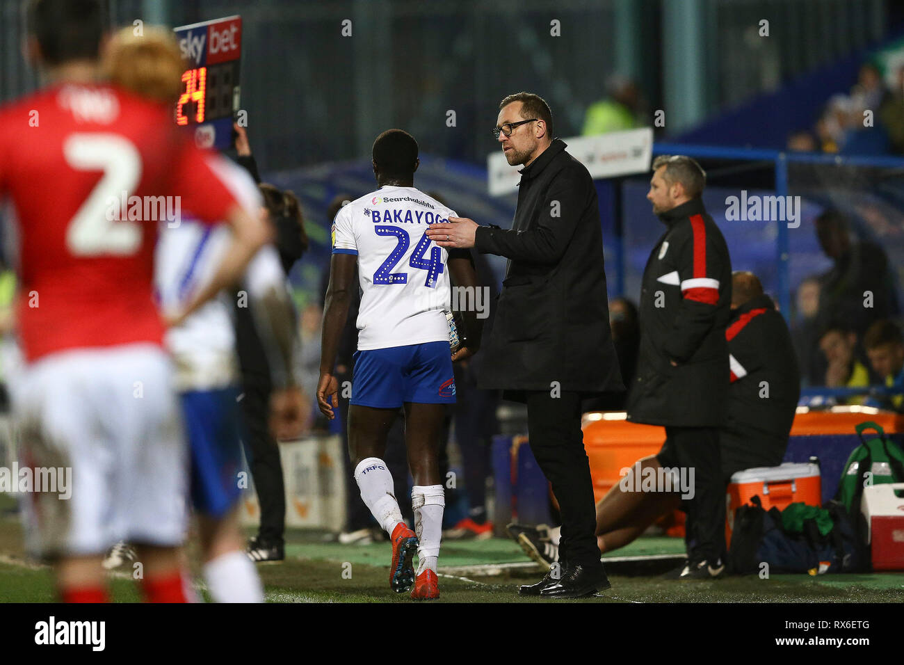 Birkenhead, UK. 08th Mar, 2019. Crewe Alexandra Manager David Artell (l) gives Zoumana Bakayogo of Tranmere Rovers a tap on the back as he is substituted. EFL Skybet Football league two match, Tranmere Rovers v Crewe Alexandra at Prenton Park, Birkenhead, Wirral on Friday 8th March 2019. this image may only be used for Editorial purposes. Editorial use only, license required for commercial use. No use in betting, games or a single club/league/player publications.pic by Chris Stading/Andrew Orchard sports photography/Alamy Live News Credit: Andrew Orchard sports photography/Alamy Live News Stock Photo