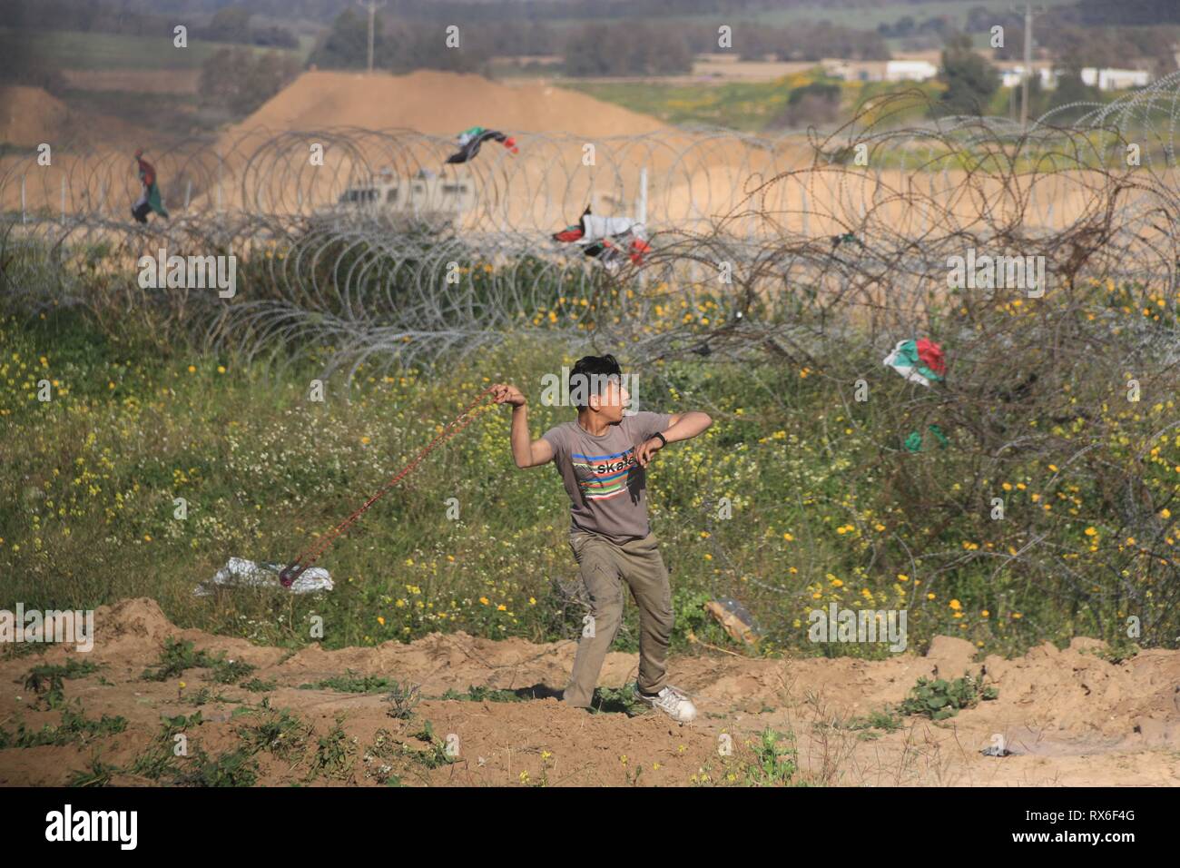 March 8, 2019 - Al-Buraj Refugee Camp, The Gaza Strip, Palestine - Palestinian protesters east of al-Buraj refugee camp in central of the Gaza Strip during friday clashes, Gaza health ministry said a Palestinian protester shot died and 50 others wounded. Credit: Mahmoud Khattab/Quds Net News/ZUMA Wire/Alamy Live News Stock Photo