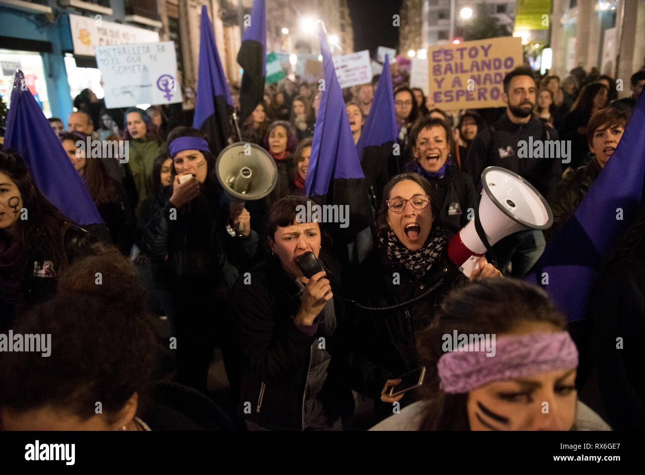 Women are seen shouting with megaphones during the demonstration of the International Woman´s Day in Granada. 60.000 people gathered on the streets of Granada against violence against women and to demand gender equality between men and women. Stock Photo