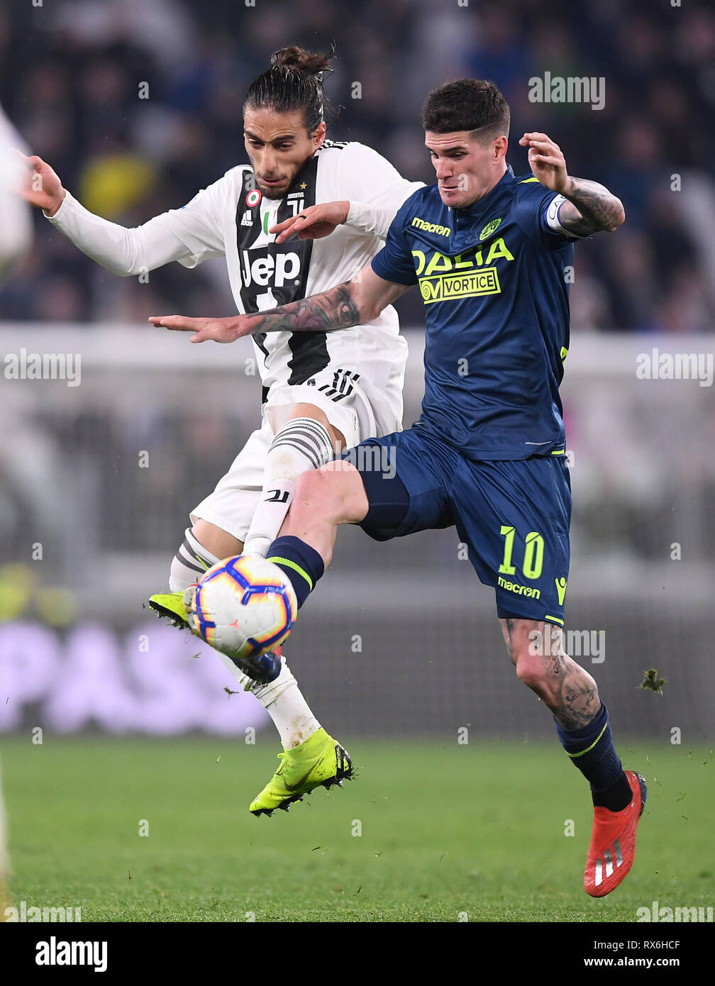 Turin, Italy. 8th Mar, 2019. FC Juventus's Martin Caceres (L) vies with Udinese's Rodrigo De Paul during a Serie A soccer match between Juventus and Udinese in Turin, Italy, March 8, 2019. Juventus won 4-1. Credit: Alberto Lingria/Xinhua/Alamy Live News Stock Photo