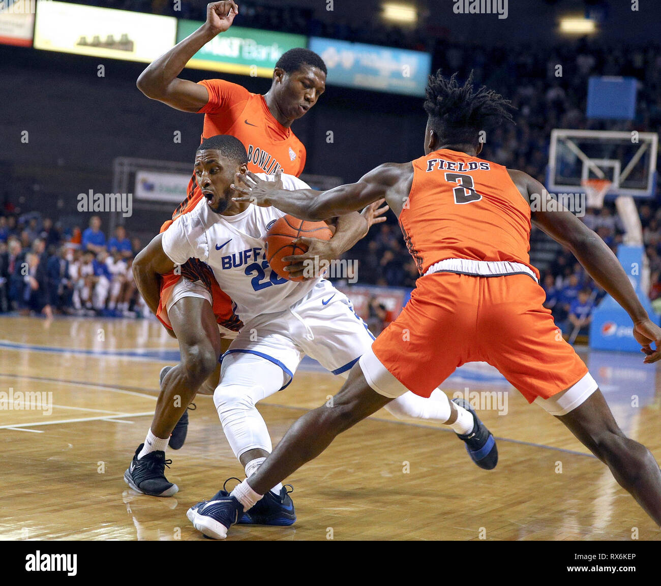 New York, USA. 8th Mar 2019. Mar 08, 2019: Buffalo Bulls guard Dontay Caruthers (22) drives ball to the basket against Bowling Green Falcons forward Daeqwon Plowden (25) and guard Caleb Fields (3) during the first half of play in the NCAA Basketball game between the Bowling Green Falcons and Buffalo Bulls at Alumni Arena in Amherst, N.Y. (Nicholas T. LoVerde/Cal Sport Media) Credit: Cal Sport Media/Alamy Live News Stock Photo