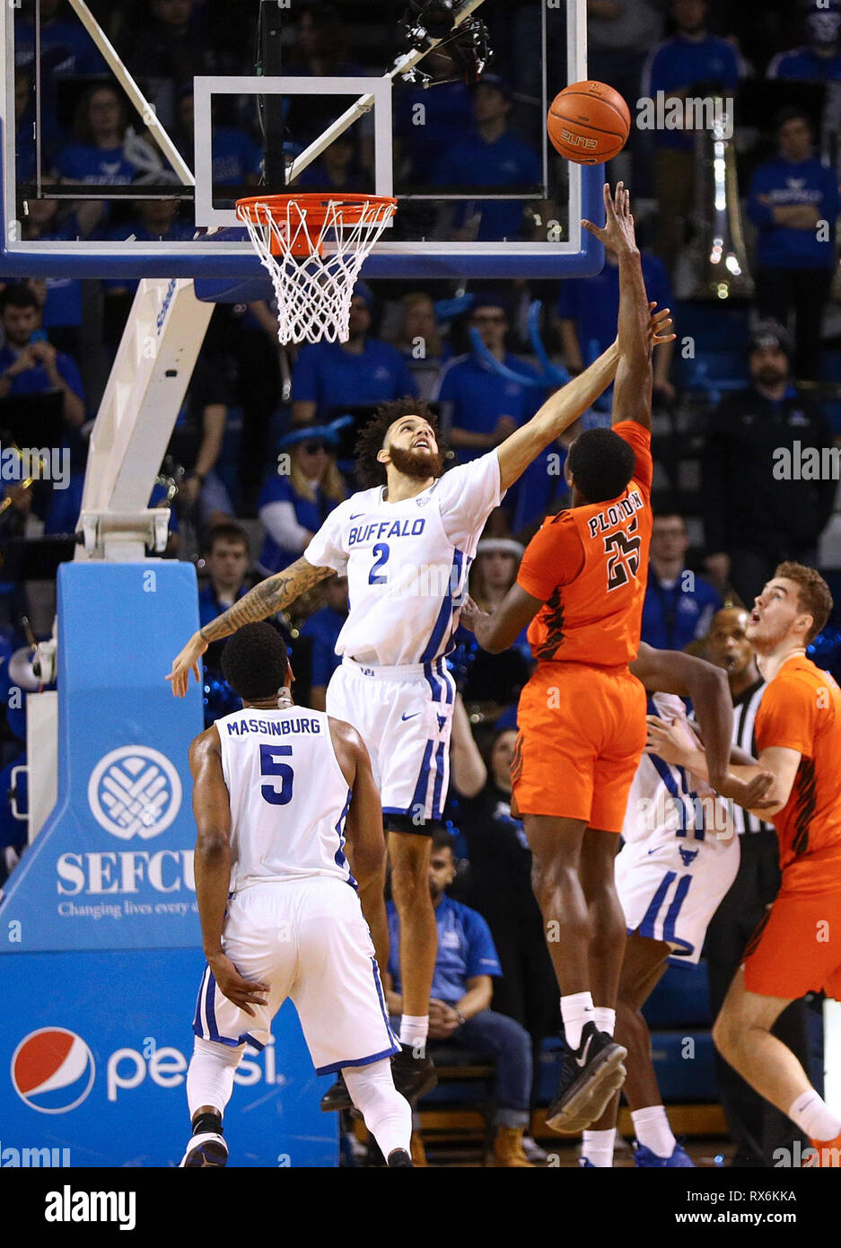 New York, USA. 8th Mar 2019. Mar 08, 2019: Buffalo Bulls guard Jeremy Harris (2) looks to block a shot by Bowling Green Falcons forward Daeqwon Plowden (25) during the second half of play in the NCAA Basketball game between the Bowling Green Falcons and Buffalo Bulls at Alumni Arena in Amherst, N.Y. (Nicholas T. LoVerde/Cal Sport Media) Credit: Cal Sport Media/Alamy Live News Stock Photo