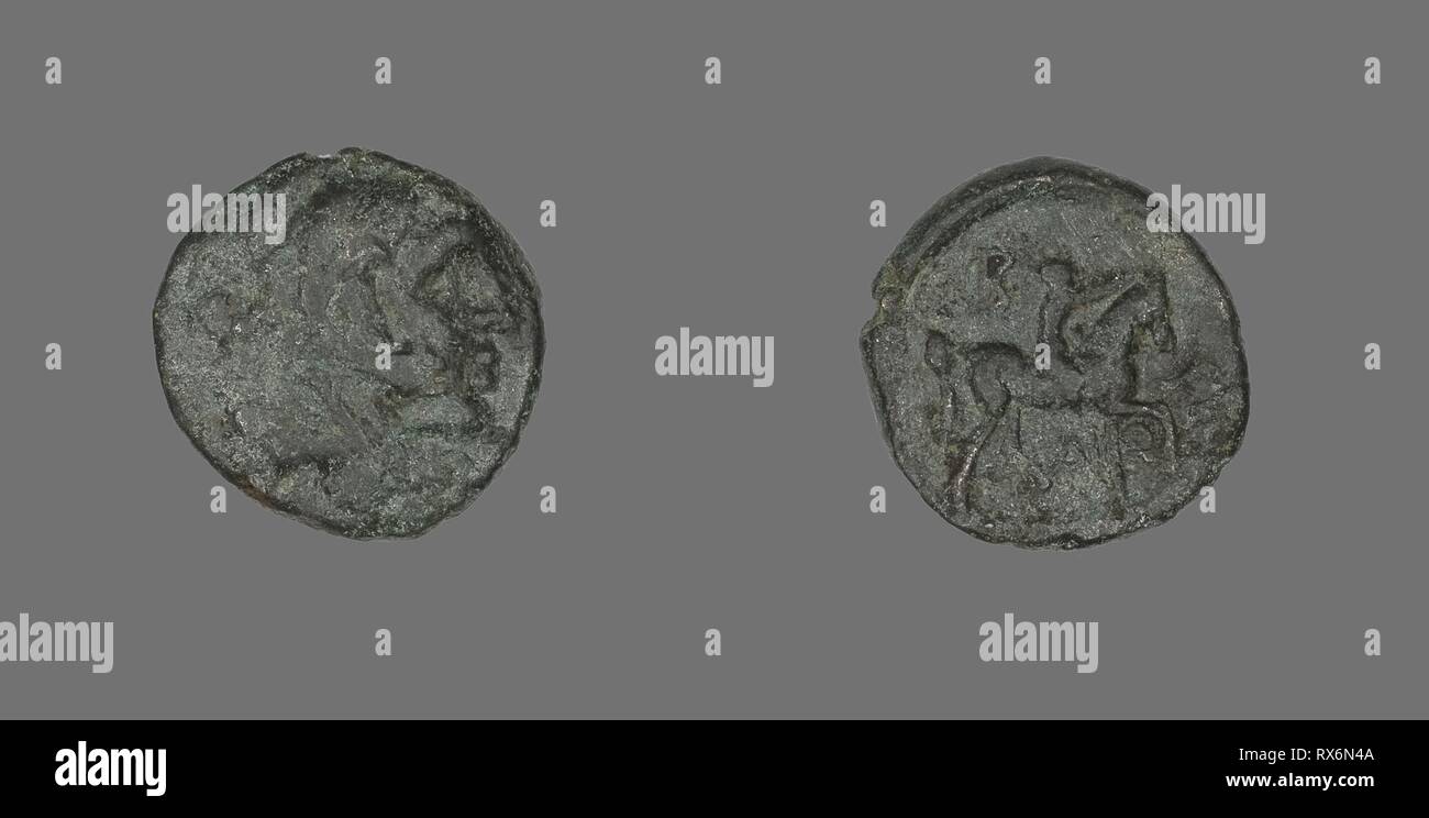 Coin Depicting the Hero Herakles. Greek. Date: 277 BC-239 BC. Dimensions: Diam. 1.8 cm; 3.90 g. Bronze. Origin: Ancient Greece. Museum: The Chicago Art Institute. Stock Photo