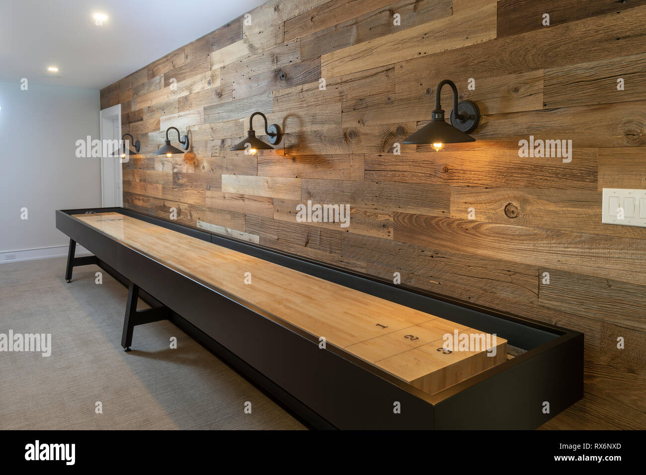 Table Shuffleboard in residential home Stock Photo