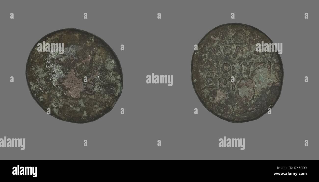 Coin Depicting the Hero Herakles. Greek. Date: 200 BC-133 BC. Dimensions: Diam. 2 cm; 5.37 g. Bronze. Origin: Ancient Greece. Museum: The Chicago Art Institute. Stock Photo