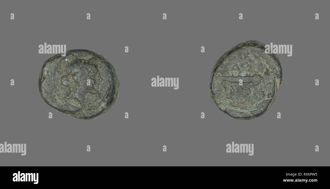 Coin Depicting the God Apollo. Greek. Date: 133 BC. Dimensions: Diam. 1.5 cm; 3.93 g. Bronze. Origin: Ancient Greece. Museum: The Chicago Art Institute. Stock Photo