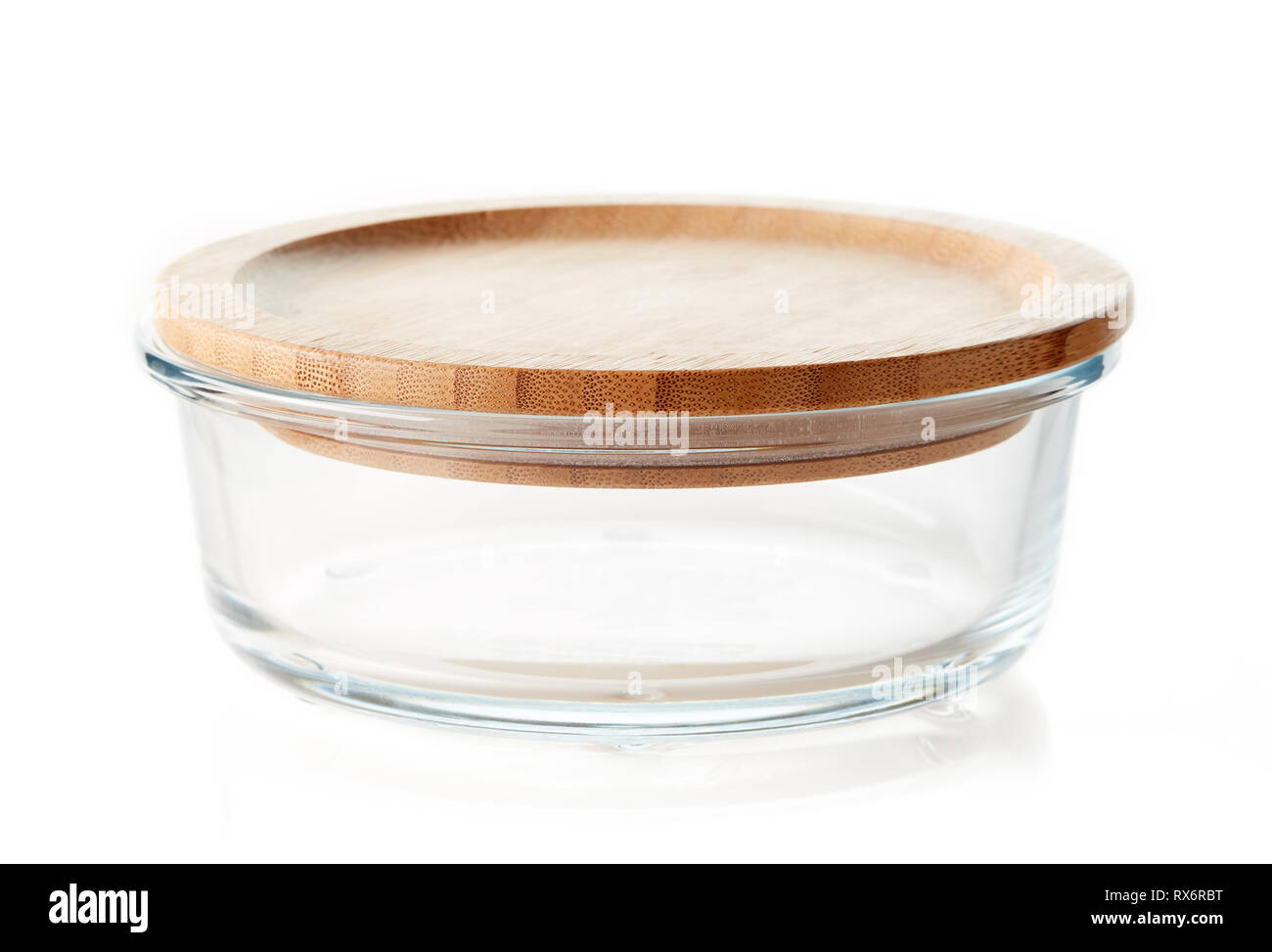 Glass food containers with wooden lid isolated on white background