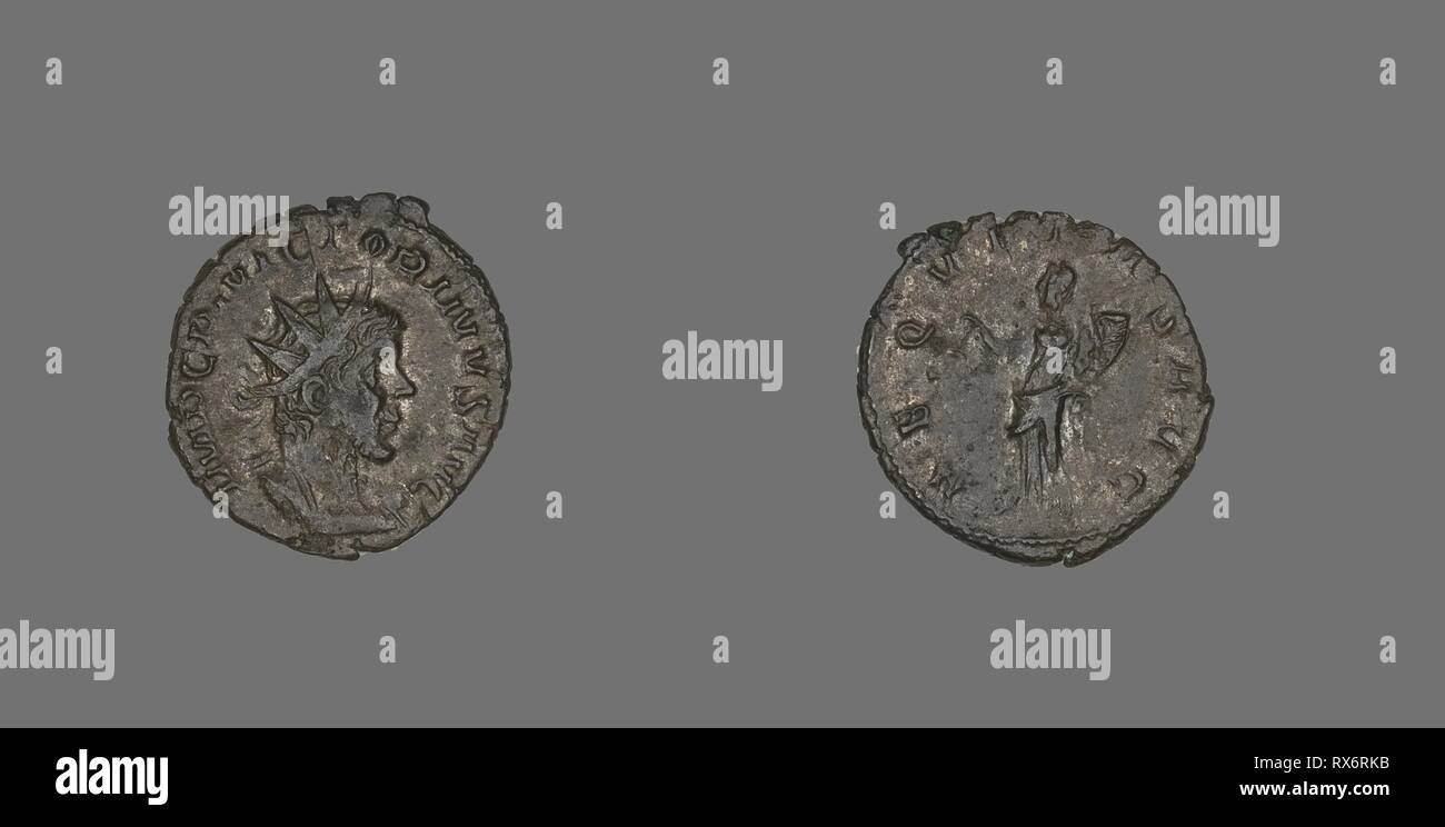 Coin Portraying Emperor Victorinus. Roman, minted in Trier. Date: 268 AD-270 AD. Dimensions: Diam. 2.1 cm; 3.14 g. Bronze. Origin: Trier. Museum: The Chicago Art Institute. Author: ANCIENT ROMAN. Stock Photo