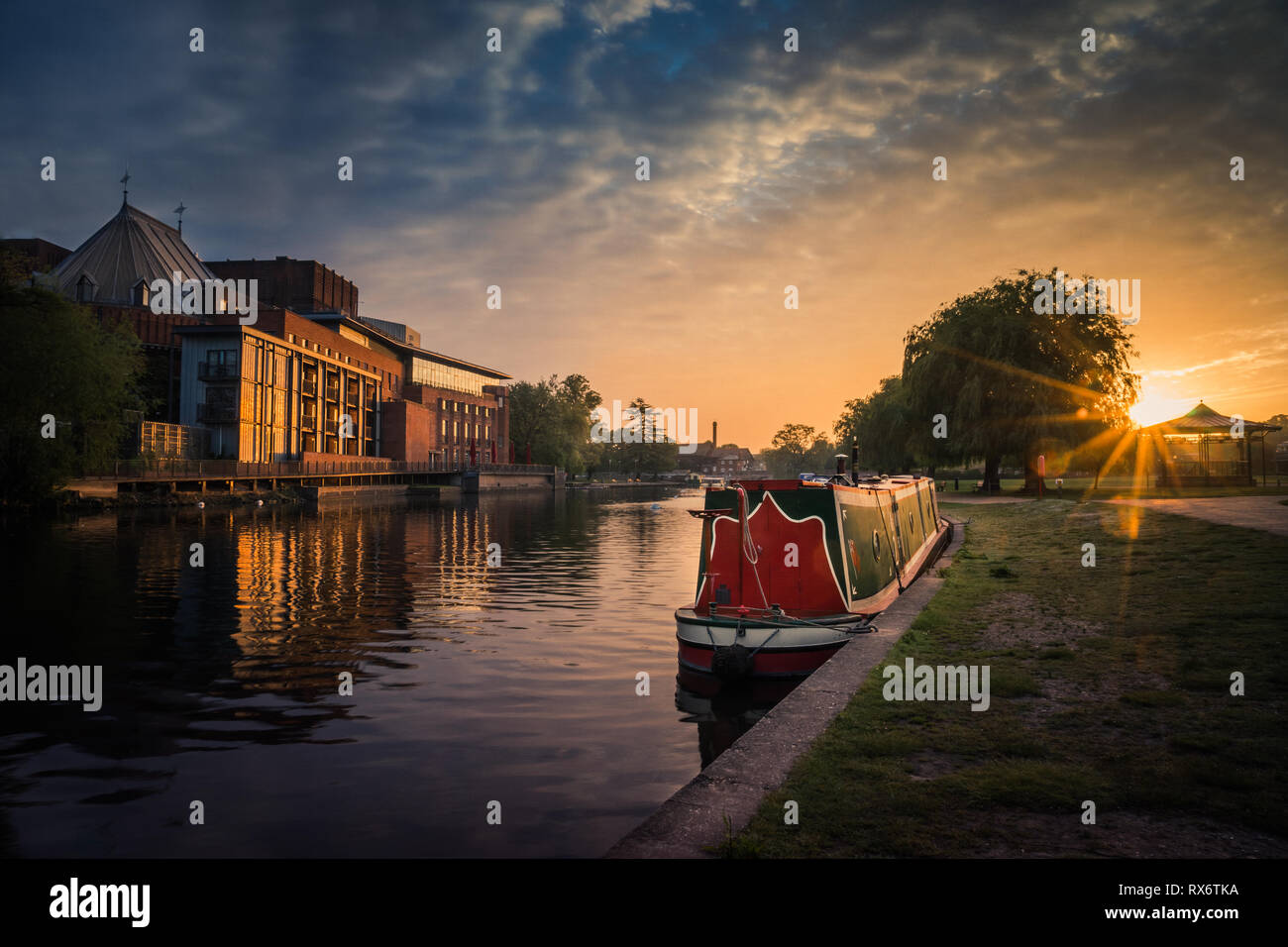 Stratford upon Avon river with Theatre and Narrowboat at sunrise Stock Photo
