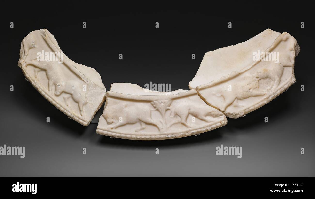 Table Rim Fragments. Late Roman or early Byzantine. Date: 301 AD-400 AD. Dimensions: a: 6.4 × 28.5 × 12.2 cm (2 1/5 × 11 ¼ × 5 5/8 in)  b: 5.7 × 34.6 × 15.8 cm (2 ¼ × 1 5/8 × 6 ¼ in)  c: 5.3 × 31.1 × 19.6 cm (2 1/8 × 12 ¼ × 7 ¾ in). Marble. Origin: Istanbul. Museum: The Chicago Art Institute. Stock Photo
