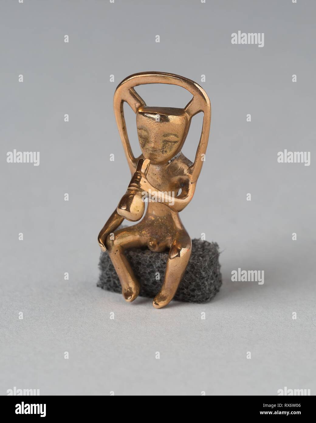 Pendant in the Form of a Seated Musician. Veraguas; Panama. Date: 1000-1500. Dimensions: H. 2.9 cm (1 1/8 in.). Gold. Origin: Panama. Museum: The Chicago Art Institute. Stock Photo