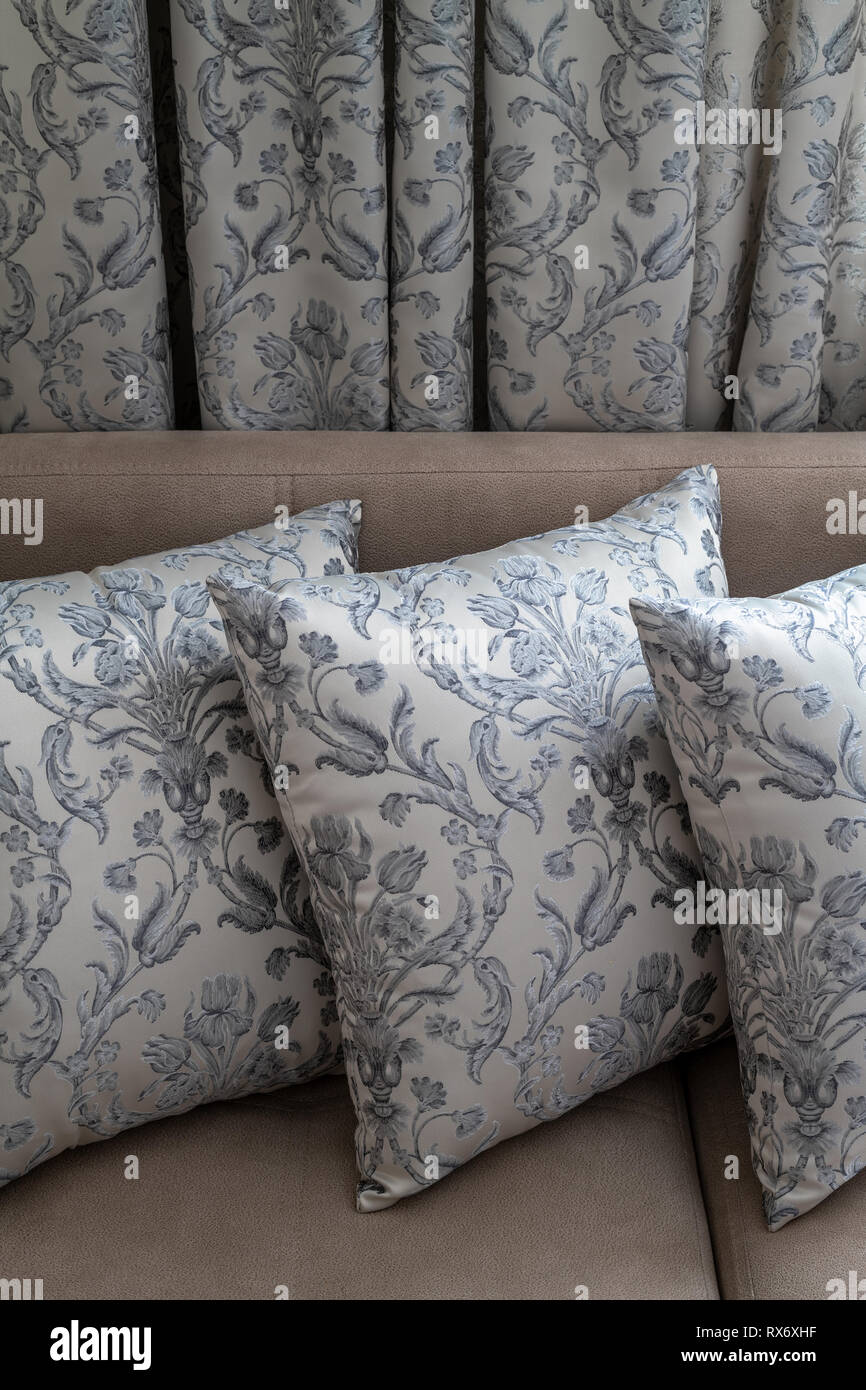 Decorative pillows and curtains of the same fabric Stock Photo