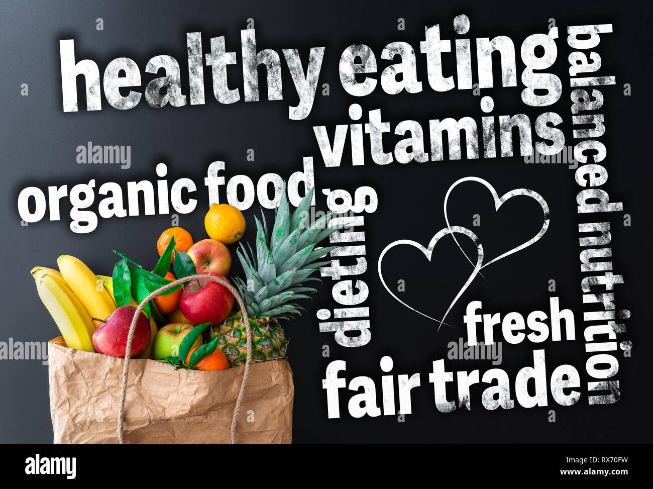 healthy eating word cloud with paper bag filled with fresh organic fruits Stock Photo