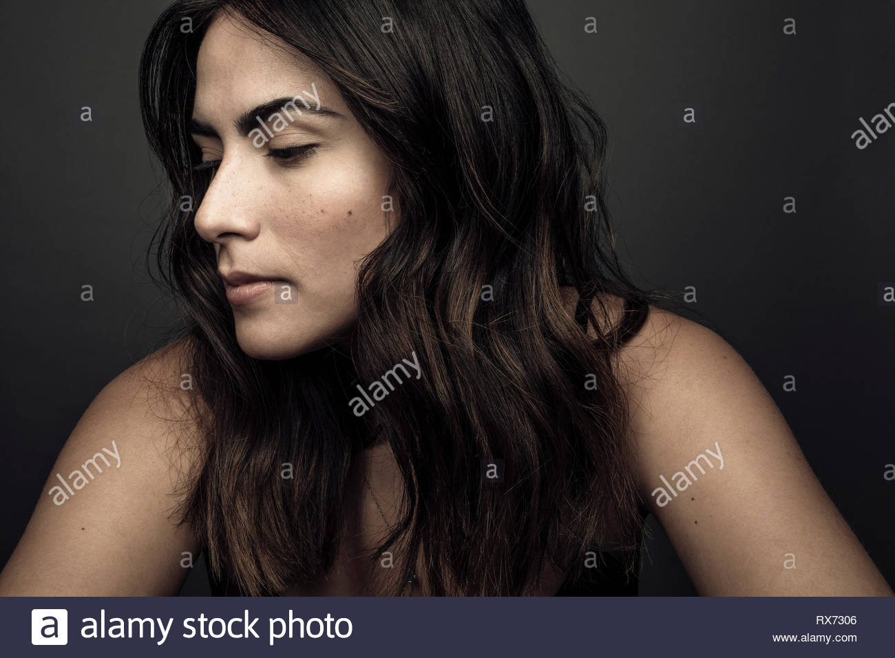 Portrait serene beautiful brunette young Latina woman Stock Photo