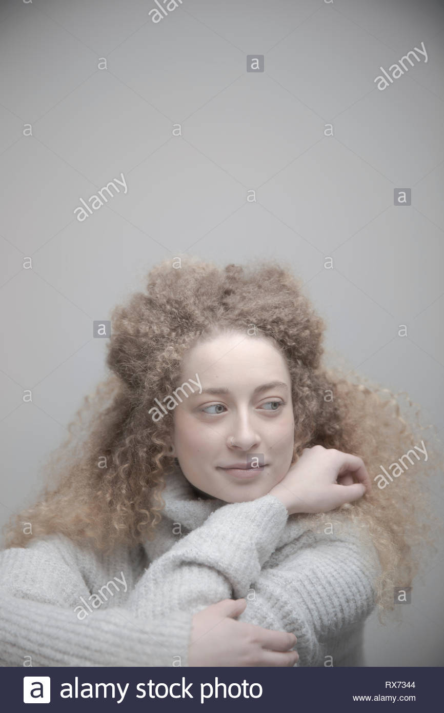 Curly blonde hair hi-res stock photography and images - Alamy