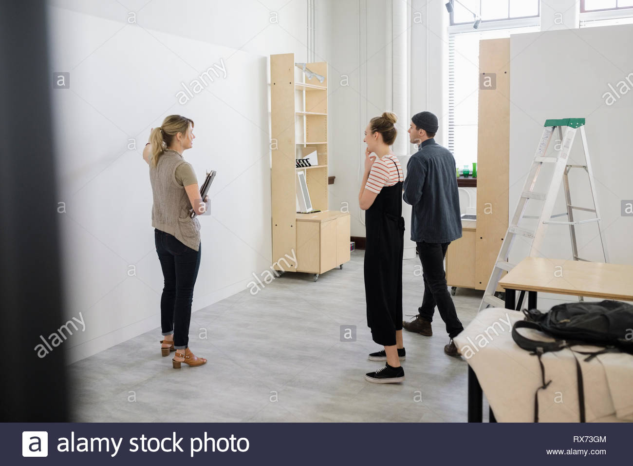 Art gallery owners preparing space for exhibition Stock Photo Alamy
