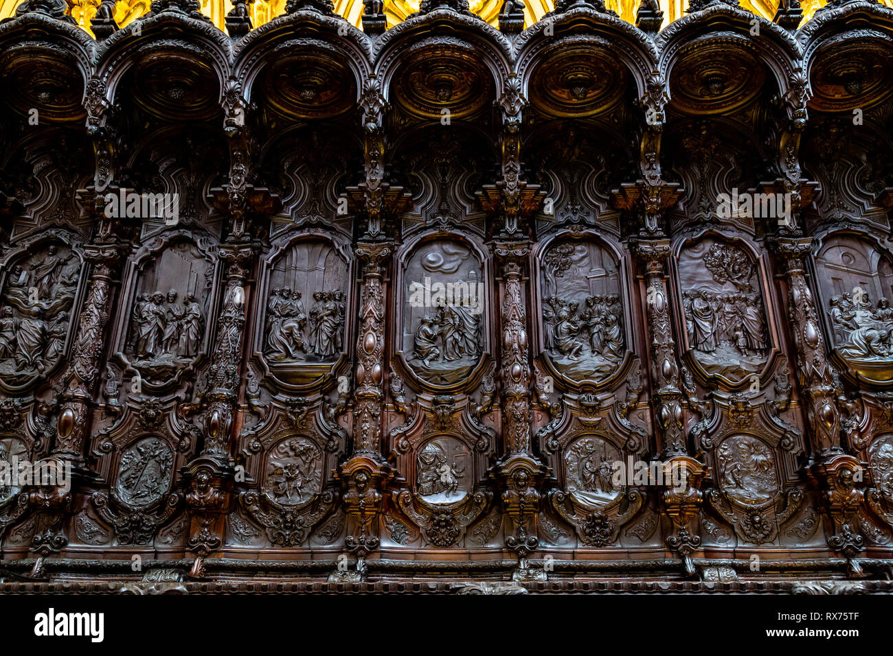 Oct 2018 - Cordoba, Spain - The wooden carved seats of the choir of Mezquita, Catedral de Cordoba, a former Moorish Mosque that is now the Cathedral o Stock Photo