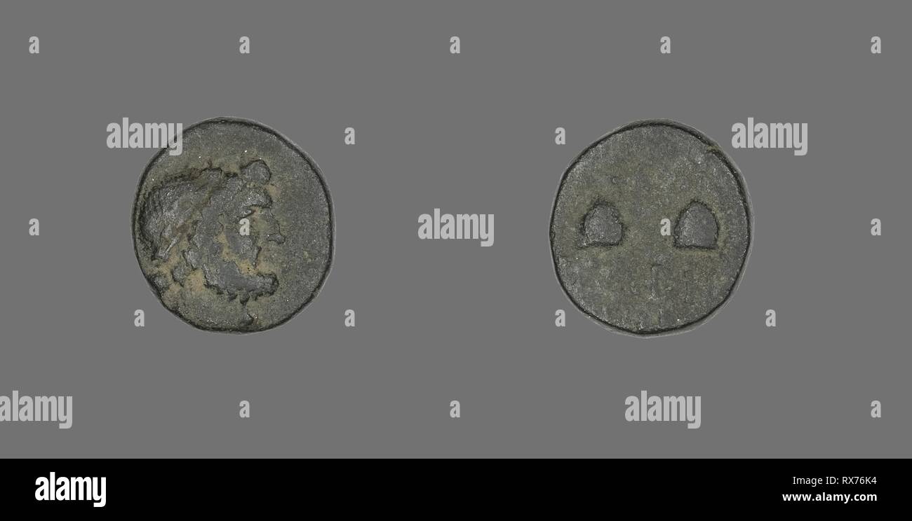 Coin Depicting the God Zeus. Greek. Date: 100 BC-1 BC. Dimensions: Diam. 1.5 cm; 4.28 g. Bronze. Origin: Ancient Greece. Museum: The Chicago Art Institute. Stock Photo