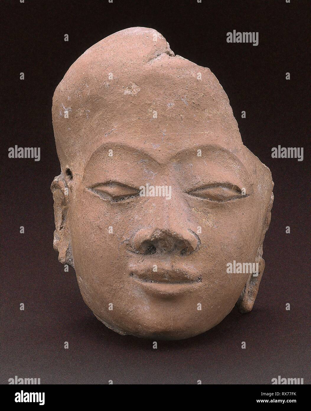 Fragment of a Face. Indonesia; Eastern Java. Date: 1301-1500. Dimensions: H. 10.2 cm (4 in.). Terracotta. Origin: Eastern Java. Museum: The Chicago Art Institute. Stock Photo