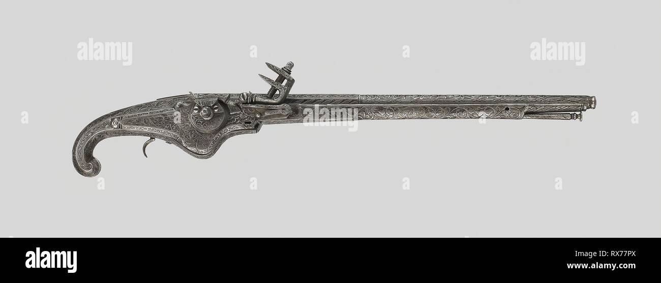 Wheellock Pistol (Pedrenyal) of King Louis XIII of France. Spanish, Ripoll. Date: 1605-1620. Dimensions: L. 55.9 cm (22 in.)   Barrel L. 42.5 cm (16 3/4 in.)  Wt. 3 lb. 9 oz.  Caliber .44. Steel, iron, and walnut. Origin: Ripoll. Museum: The Chicago Art Institute. Stock Photo