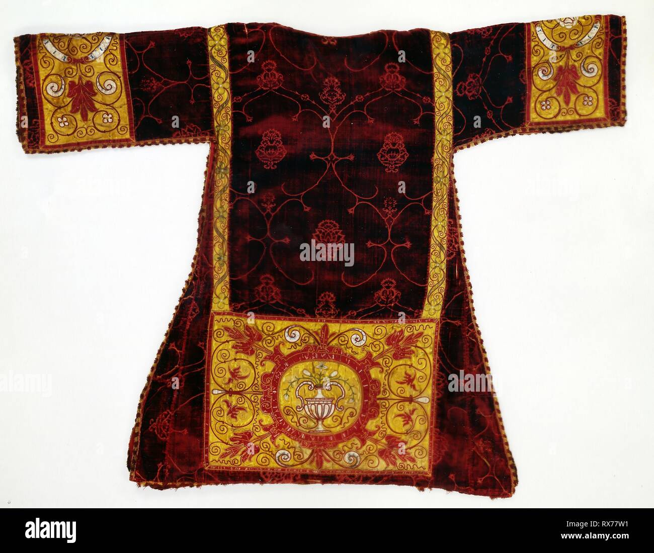 Dalmatic. Italy. Date: 1475-1500. Dimensions: 114.3 x 145.6 cm (45 x 57 1/4 in.)  Velvet repeat: 52.6 x 29.2 cm (20 3/4 x 11 1/2 in.). Silk, warp-float faced 4:1 satin weave with supplementary pile warps forming cut voided velvet; apparels: silk, warp-float faced 7:1 satin weave; appliquéd with warp-float faced 7:1 satin weave; painted; embroidered and appliquéd with silk in laid work and couching; fringe: silk, warp faced plain weave with extended ground weft fringe; lining: cotton, warp-float faced 4:1 satin weave; underlining: hemp. Origin: Italy. Museum: The Chicago Art Institute. Stock Photo
