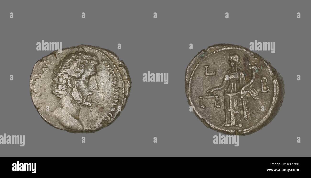 Coin Portraying Emperor Antoninus Pius. Roman, minted in Alexandria, Egypt. Date: 139 AD. Dimensions: Diam. 2.6 cm; 12.71 g. Billon. Origin: Egypt. Museum: The Chicago Art Institute. Author: Ancient Egyptian. Stock Photo