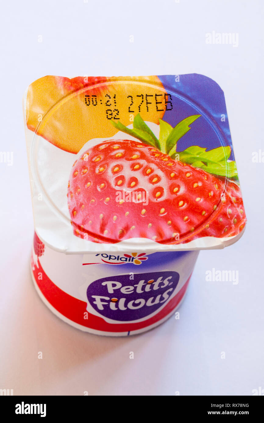 Pot of Yoplait Petits Filous strawberry flavoured yogurt isolated on white background - Greek style fruit layers - yoghurt Stock Photo
