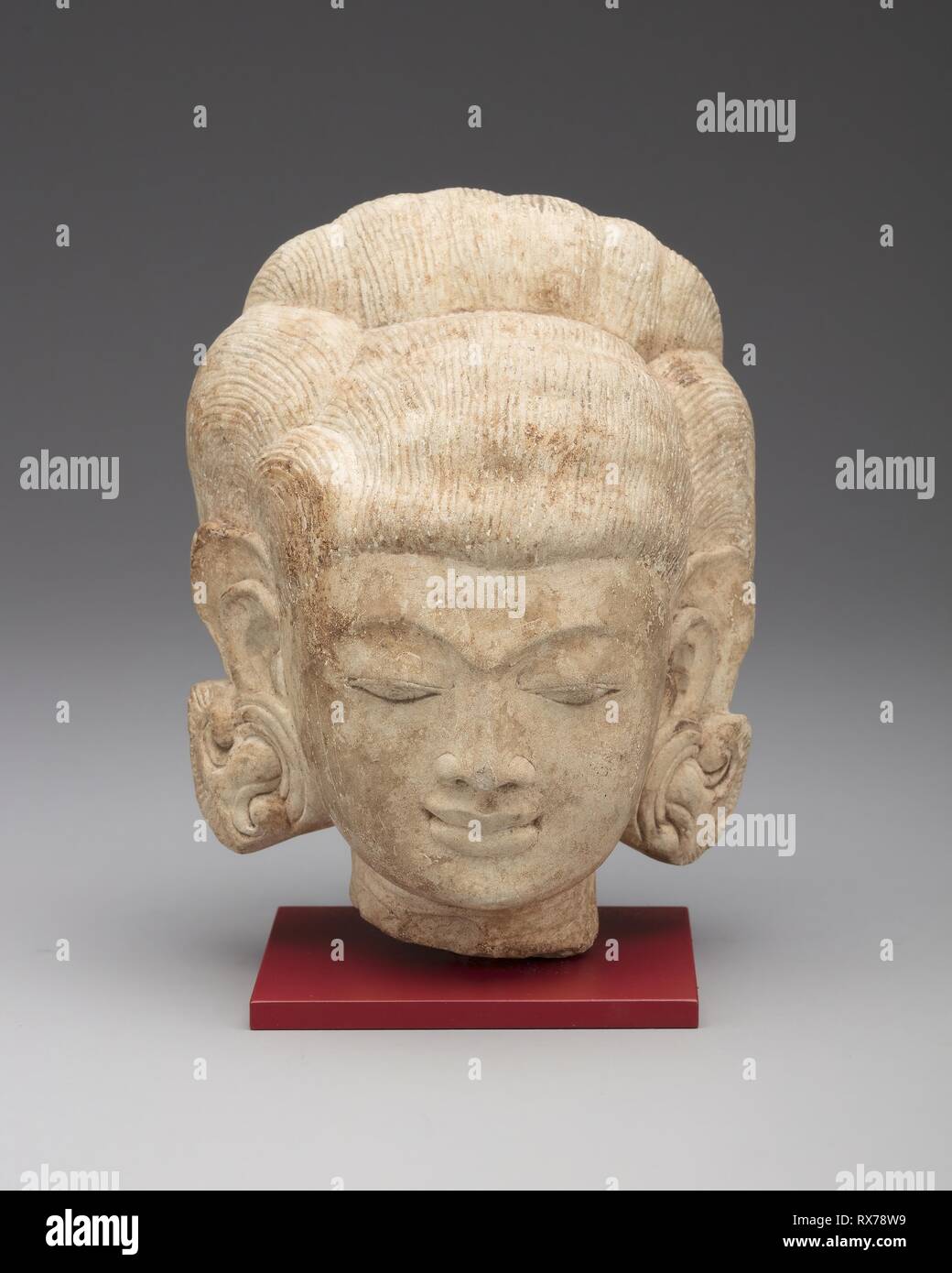 Female Head. Indonesia; Eastern Java. Date: 1201-1500. Dimensions: 17.2 × 12.8 × 12.2 cm (6 3/4 × 5 1/16 × 4 13/16 in.). Andesite. Origin: Eastern Java. Museum: The Chicago Art Institute. Stock Photo