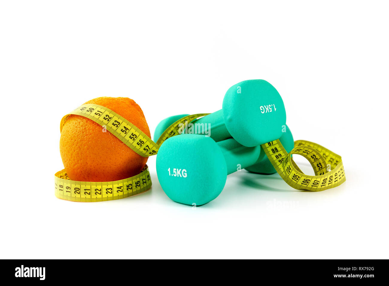 healthy eating and active lifestyle concept - dumbbells with orange and measuring tape Stock Photo