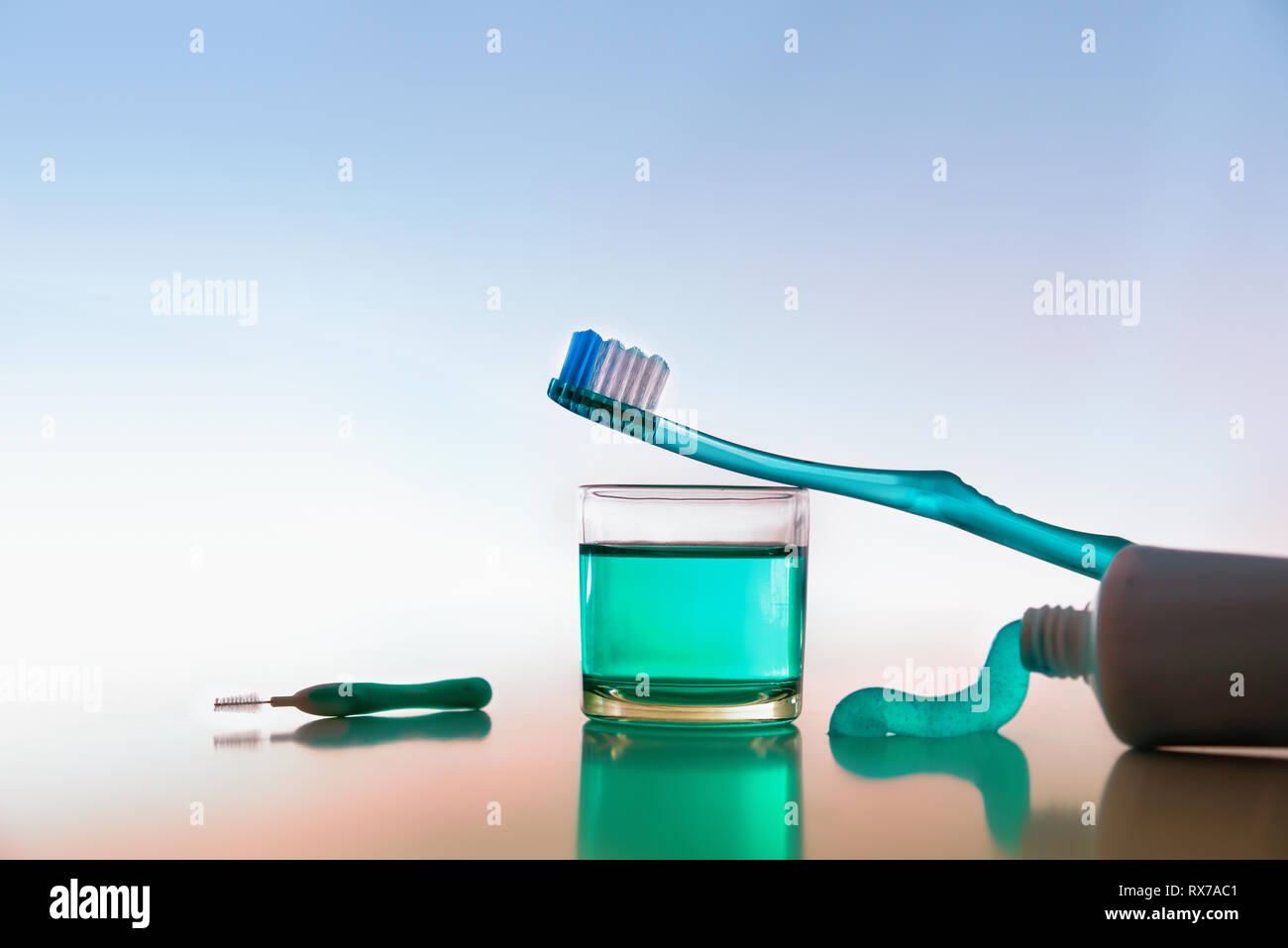 Tools and products for oral hygiene on white table. Horizontal composition. Front view. Stock Photo