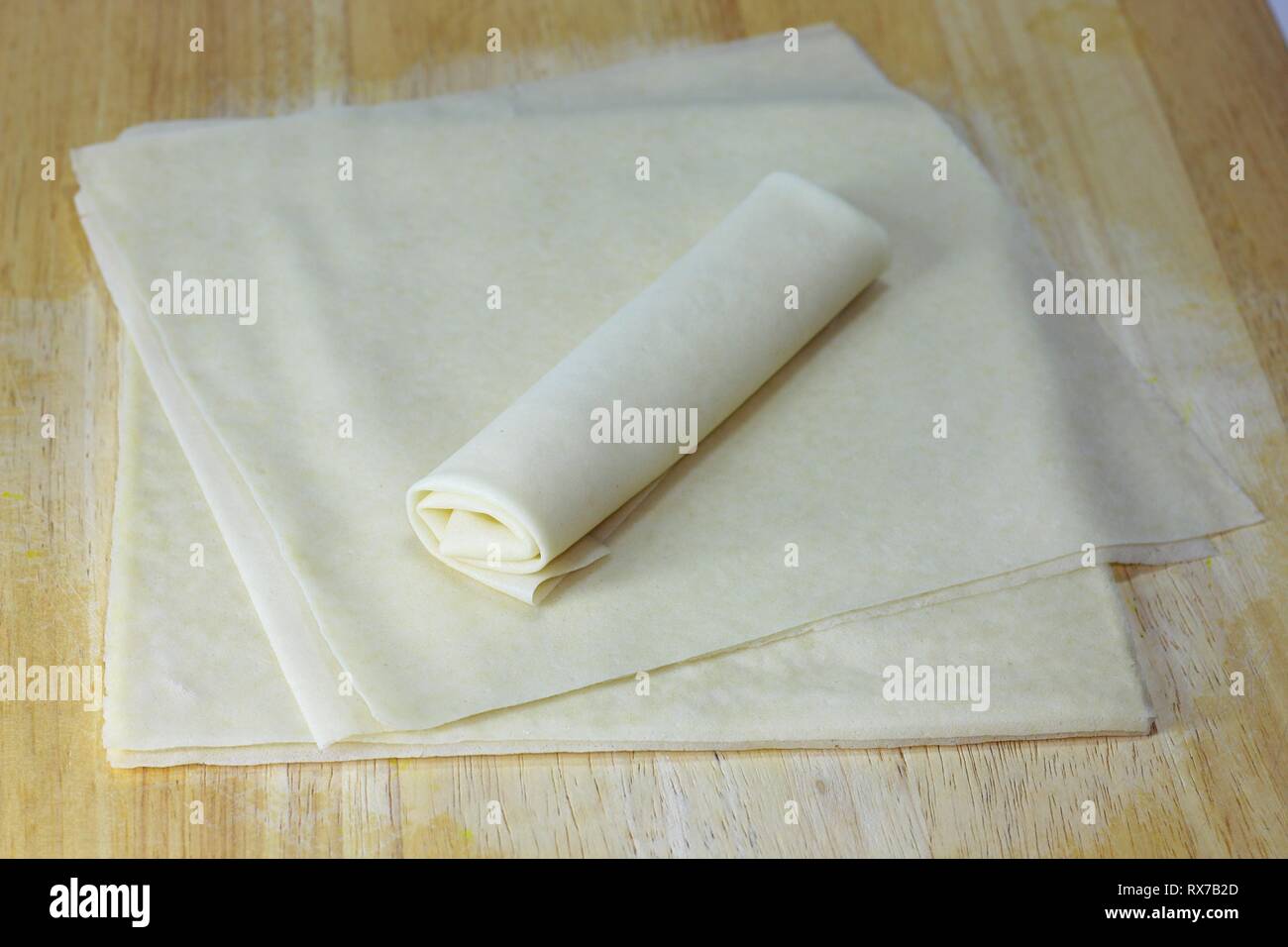 Spring Roll Wrappers on wood table. Spring roll wrappers are made from wheat flour and water