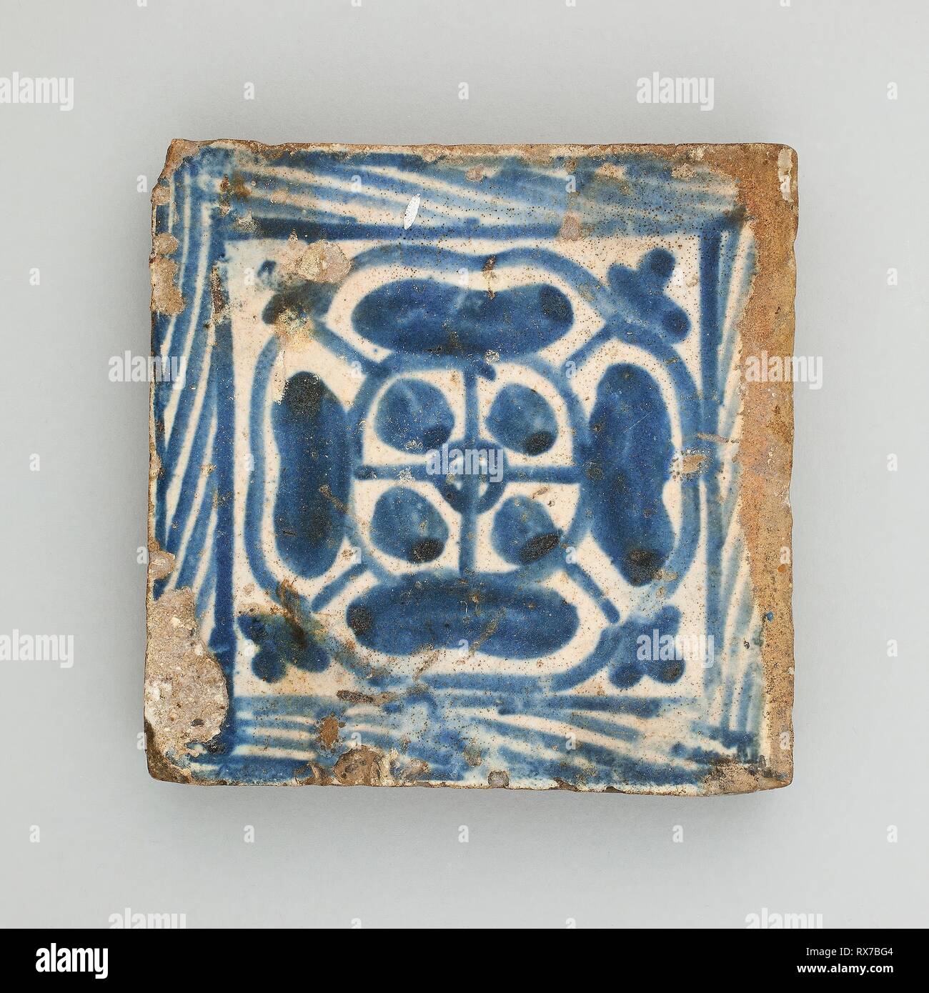 Floor Tile with Rosette. Spanish; Valencia (probably Manises). Date: 1401-1500. Dimensions: 8.7 × 9.5 cm (3 7/16 × 3 3/4 in.). Tin-glazed earthenware. Origin: Manises. Museum: The Chicago Art Institute. Stock Photo