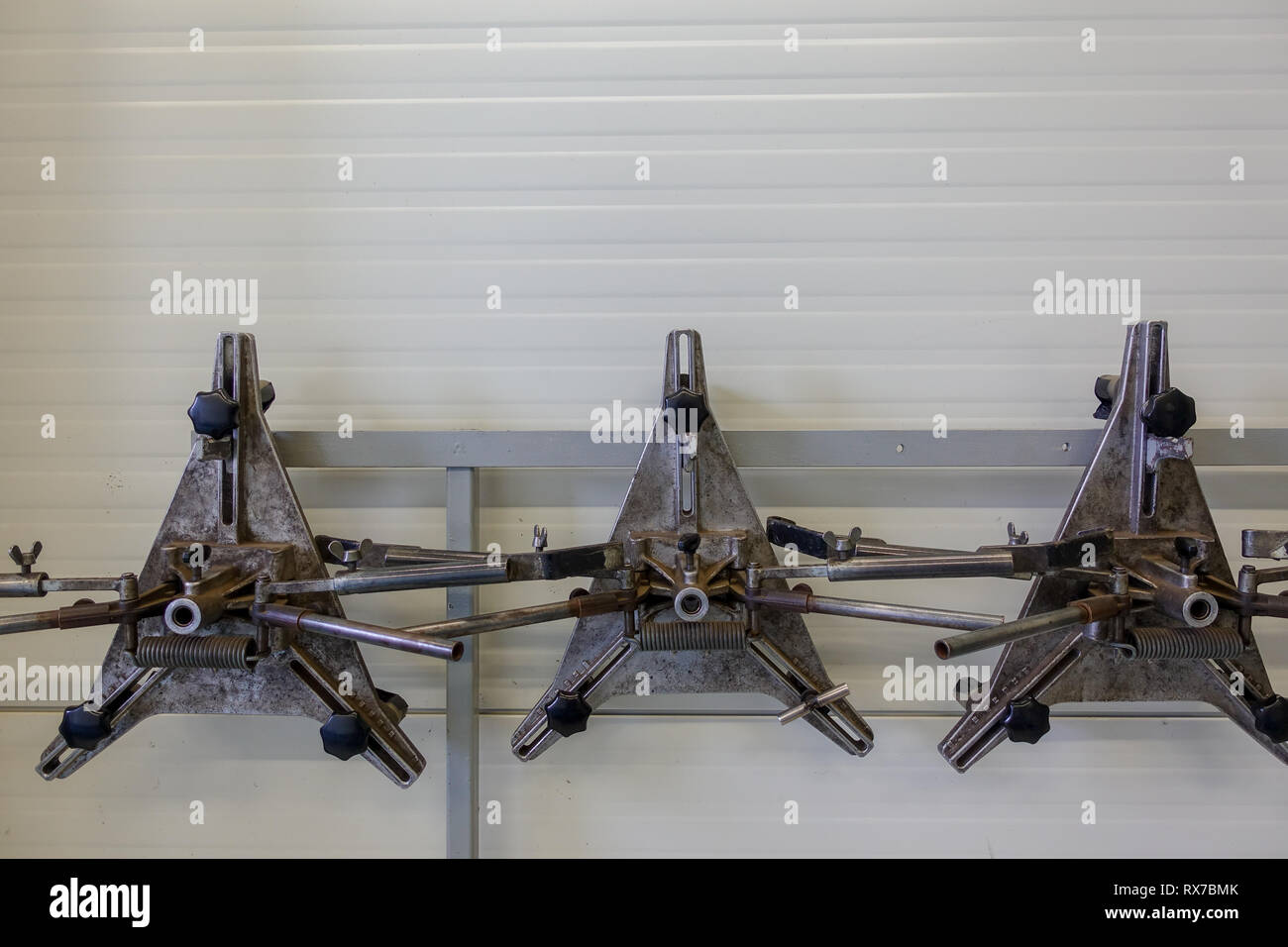 A puller for car rims in a car repair shop Stock Photo Alamy