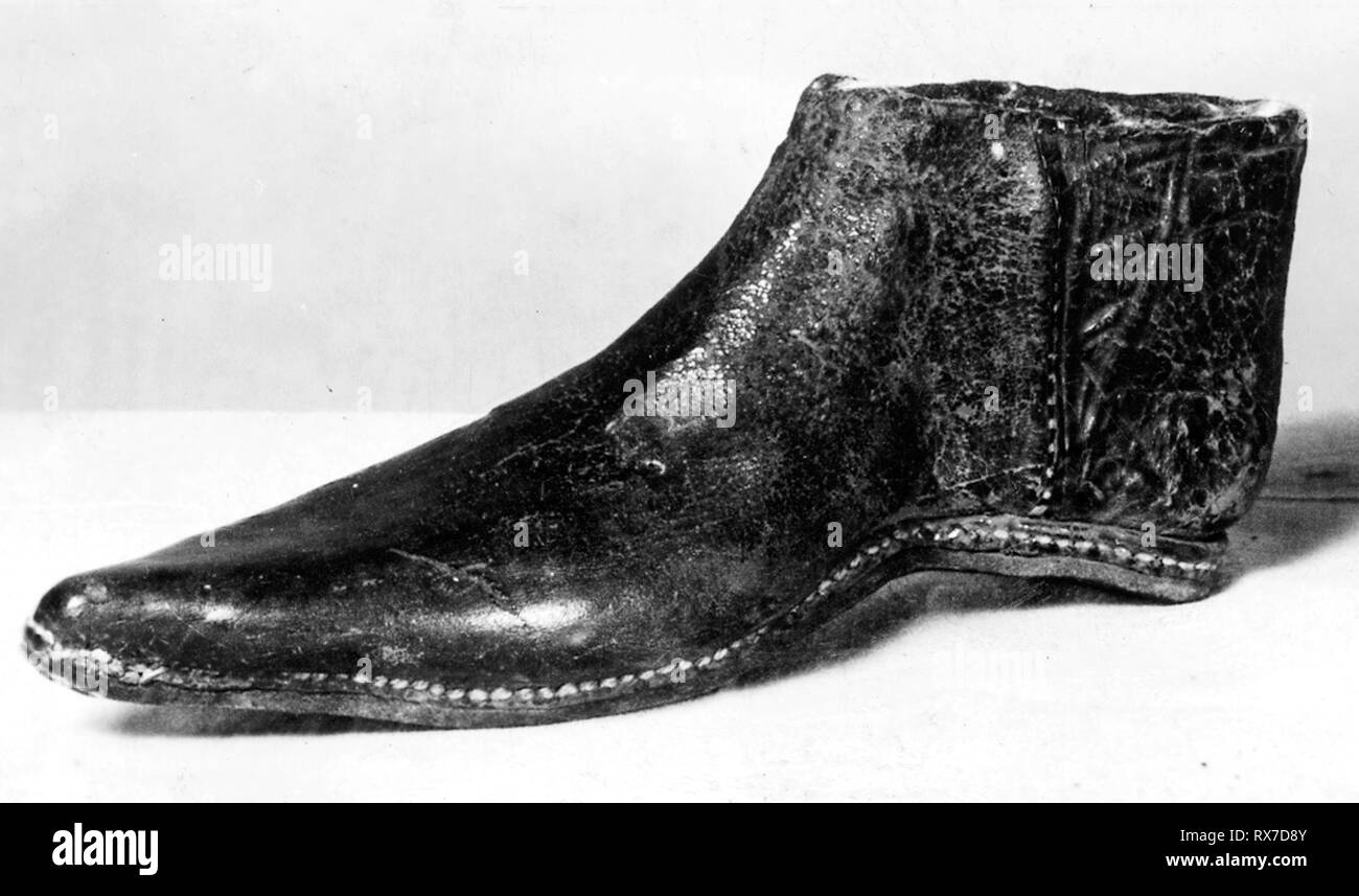Girl's Shoe. England or France. Date: 1401-1500. Dimensions: . (Black) leather (Toe originally longer end turned up). Origin: England. Museum: The Chicago Art Institute. Stock Photo