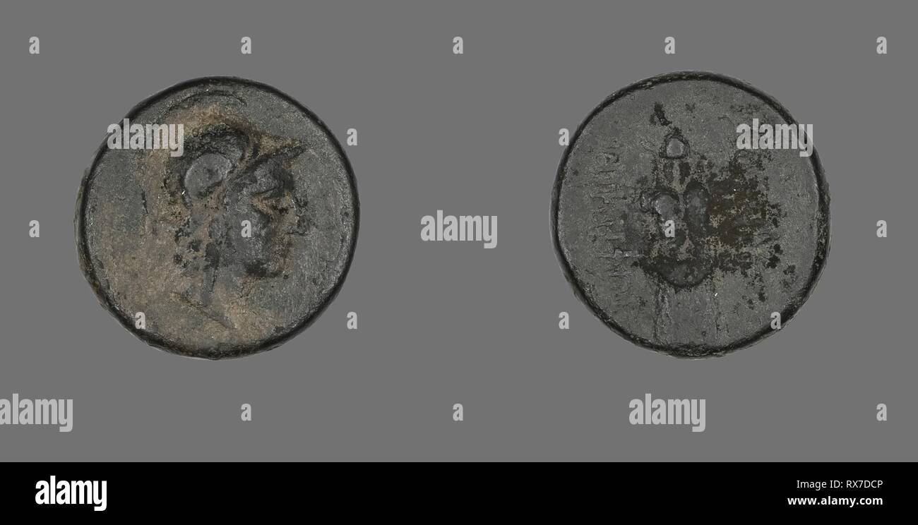 Coin Depicting the Goddess Athena. Greek. Date: 200 BC-133 BC. Dimensions: Diam. 1.9 cm; 6.62 g. Bronze. Origin: Ancient Greece. Museum: The Chicago Art Institute. Stock Photo