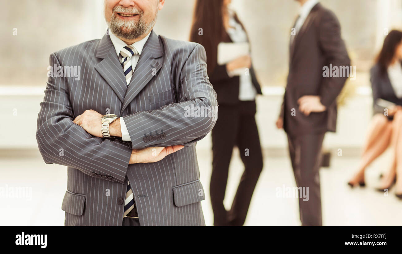 portrait of the General counsel of the company on the background of business team in office Stock Photo