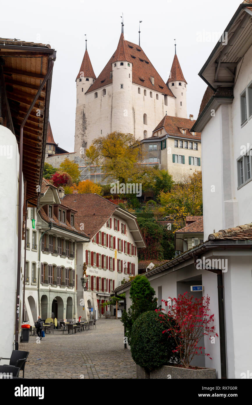 City view of Thun, with old and historical houses and the castle on the top of the city Stock Photo