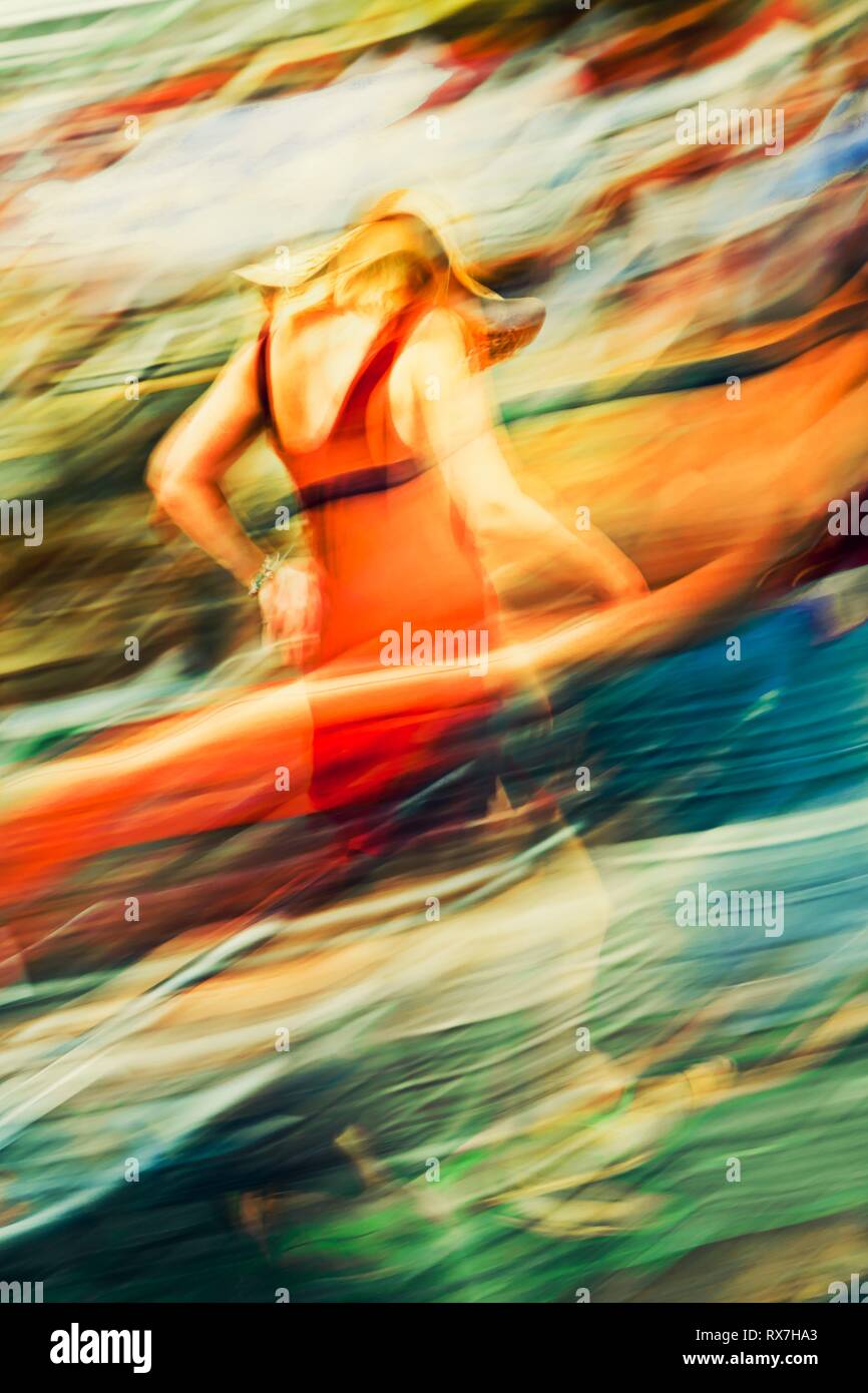 Tanned woman walking in red dress on the color swirl on the street-  Abstract Expressionism fantasy In motion Stock Photo - Alamy