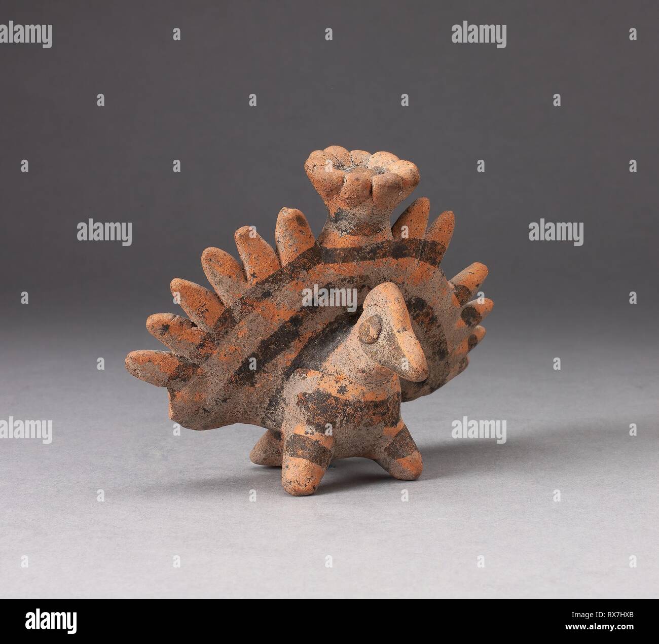 Miniature Figure in the Form of a Bird with Exaggerated Tailfeathers. Colima; Colima, Mexico. Date: 100 AD-300 AD. Dimensions: 8.6 × 11.4 cm (3 3/8 × 4 1/2 in.). Ceramic and pigment. Origin: Colima state. Museum: The Chicago Art Institute. Stock Photo