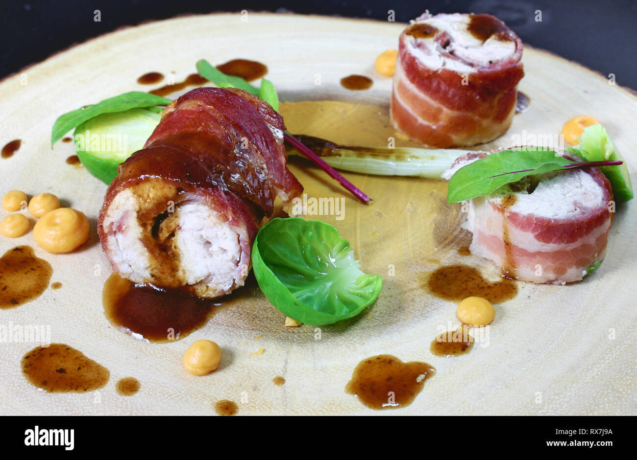 Stuffed bacon wrapped chicken roulade hires stock photography and