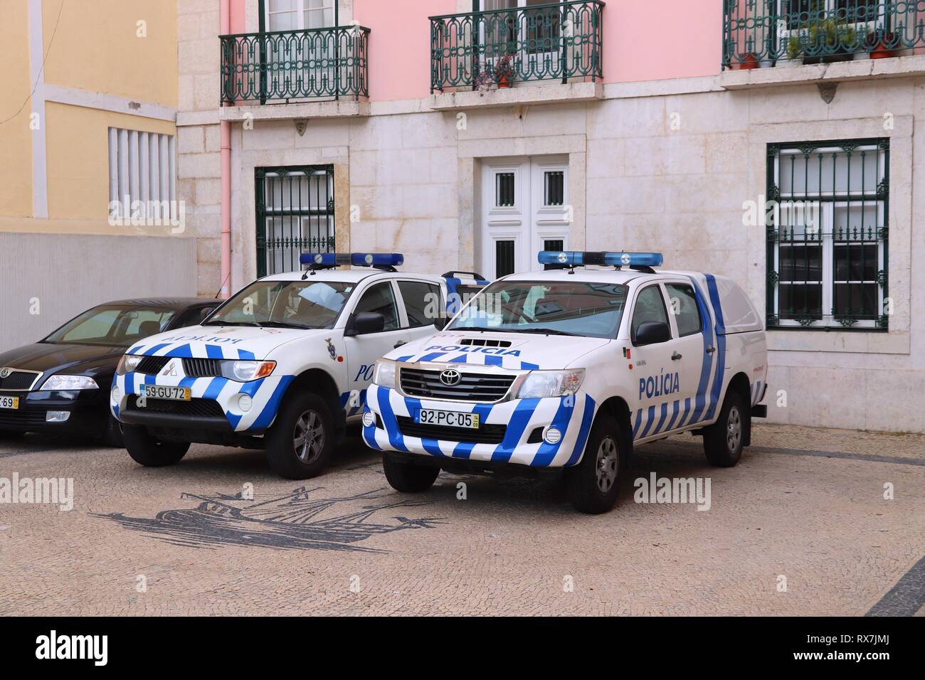 LISBON, PORTUGAL - JUNE 4, 2018: Mitsubishi L200 and Toyota Hilux of Portugal Police. The full name of the Portugese force is Public Security Police ( Stock Photo
