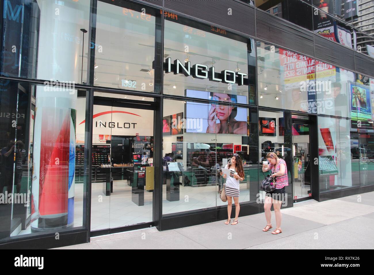 NEW YORK, USA - JULY 3, 2013: People walk by Inglot cosmetics store at  Times Square, New York. Inglot is a prestigious Polish cosmetics brand with  400 Stock Photo - Alamy