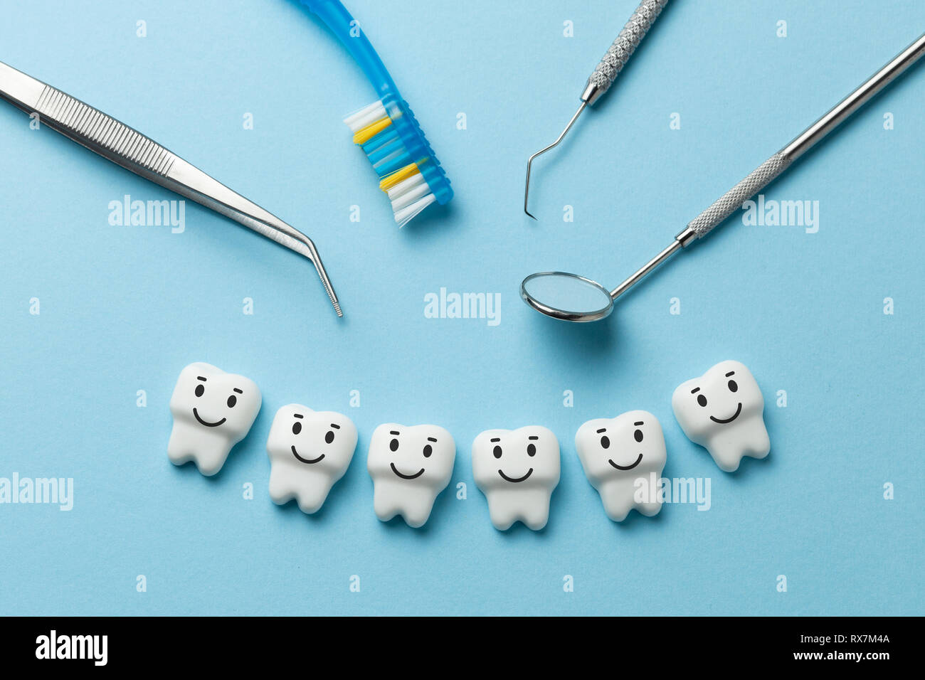 Healthy White Teeth Are Smiling On Blue Background And Dentist