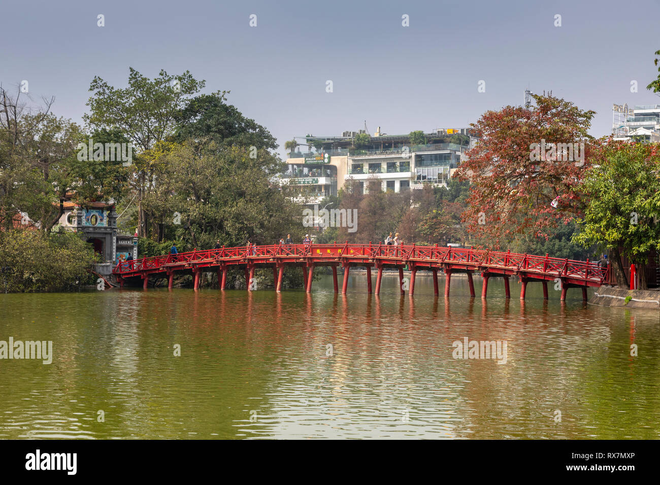 Wooden Huc Bridge also known as the Bridge off the Rising Sun because of its colour, crosses Ho Hoan Kiem lake from the Old Quarter to the Temple of t Stock Photo