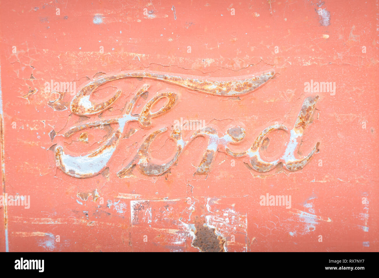 Ford car sign embossed on a classic vehicle in poor condition Stock Photo