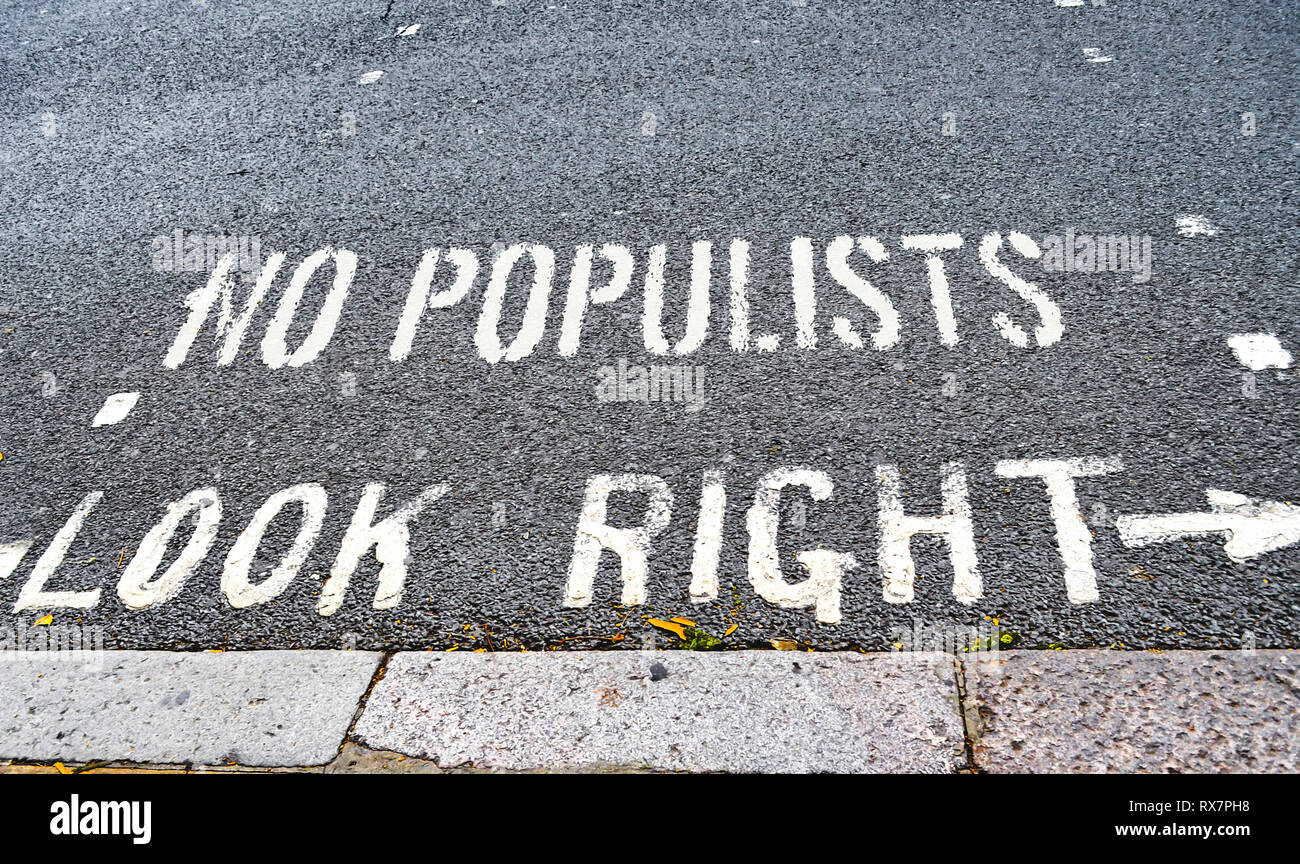 Road text that has been supplemented with a warning against populism, which is spreading more and more around the world. Stock Photo