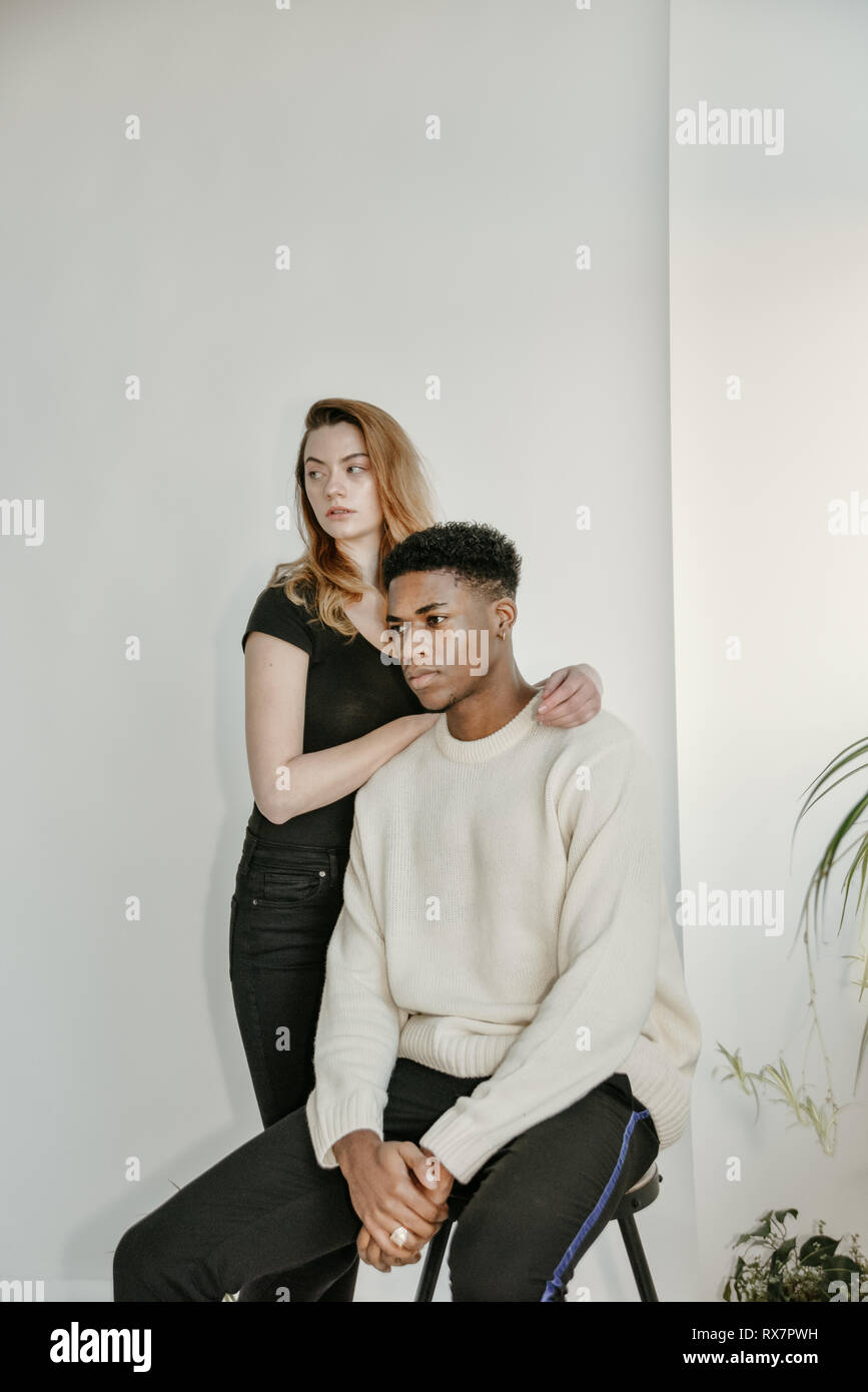 Casual young couple standing and posing Stock Photo | Adobe Stock