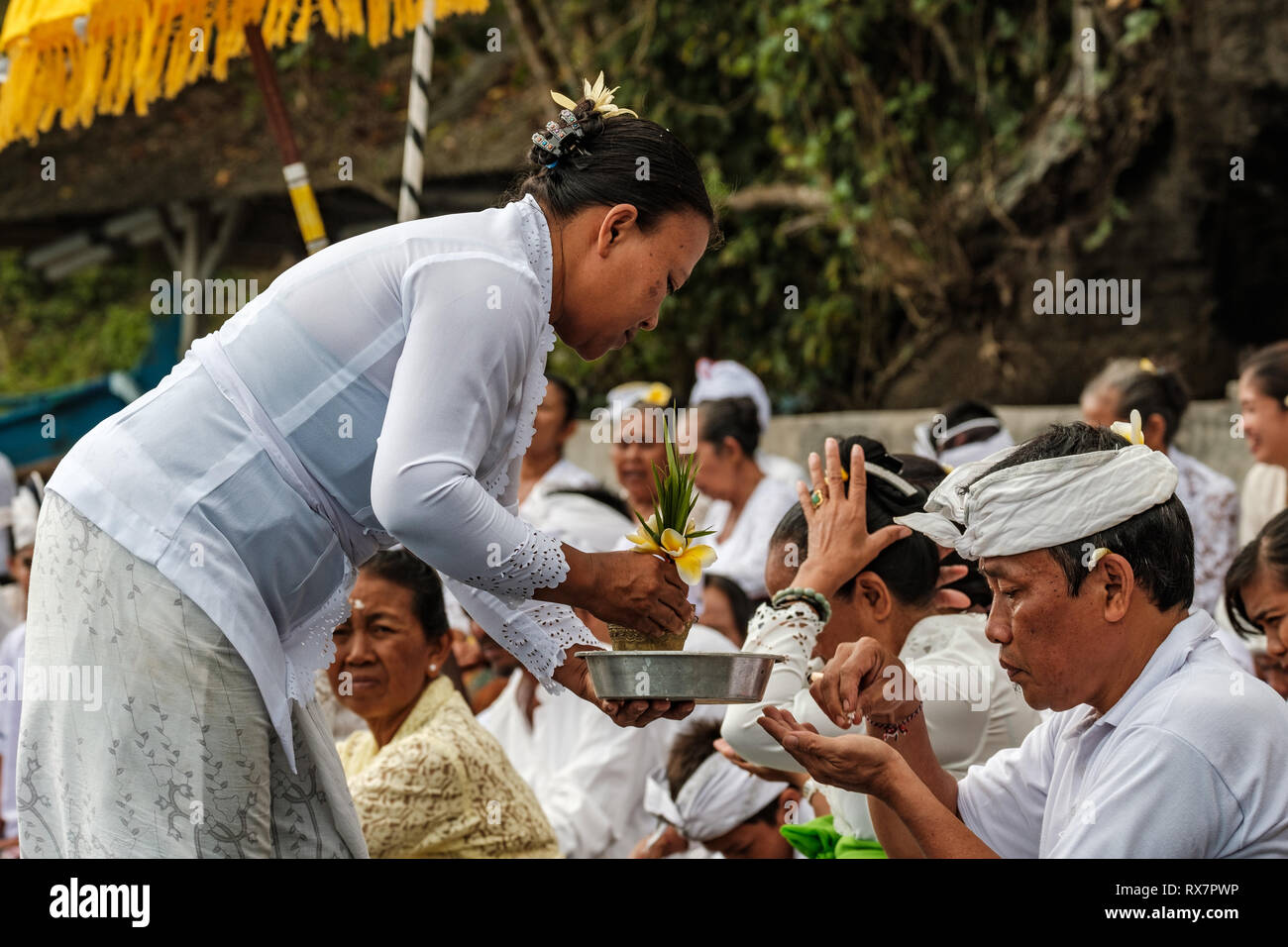 Balinese religious beach ceremony, Tabanan, Bail, Indonesia Stock Photo