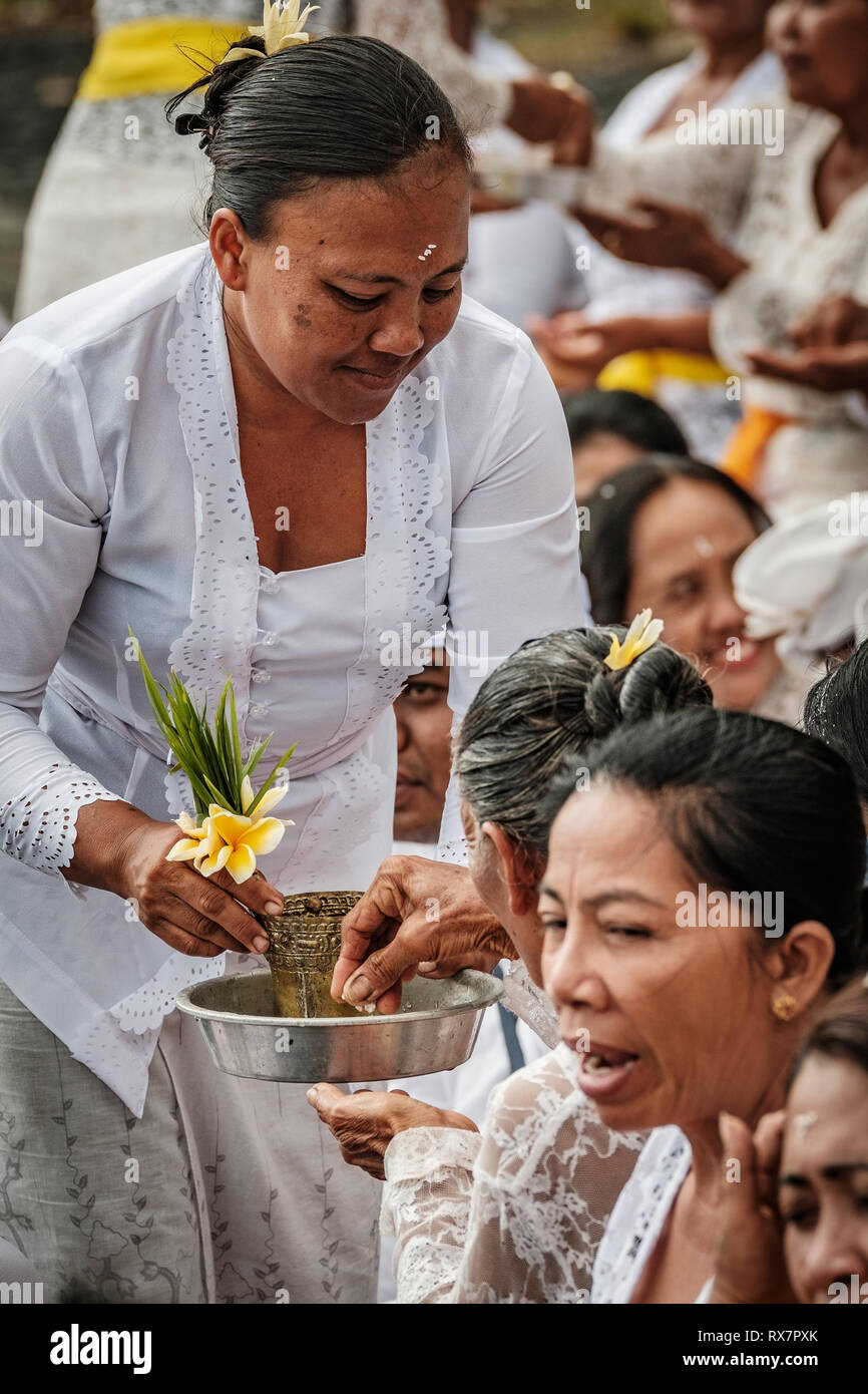 Balinese religious beach ceremony, Tabanan, Bail, Indonesia Stock Photo