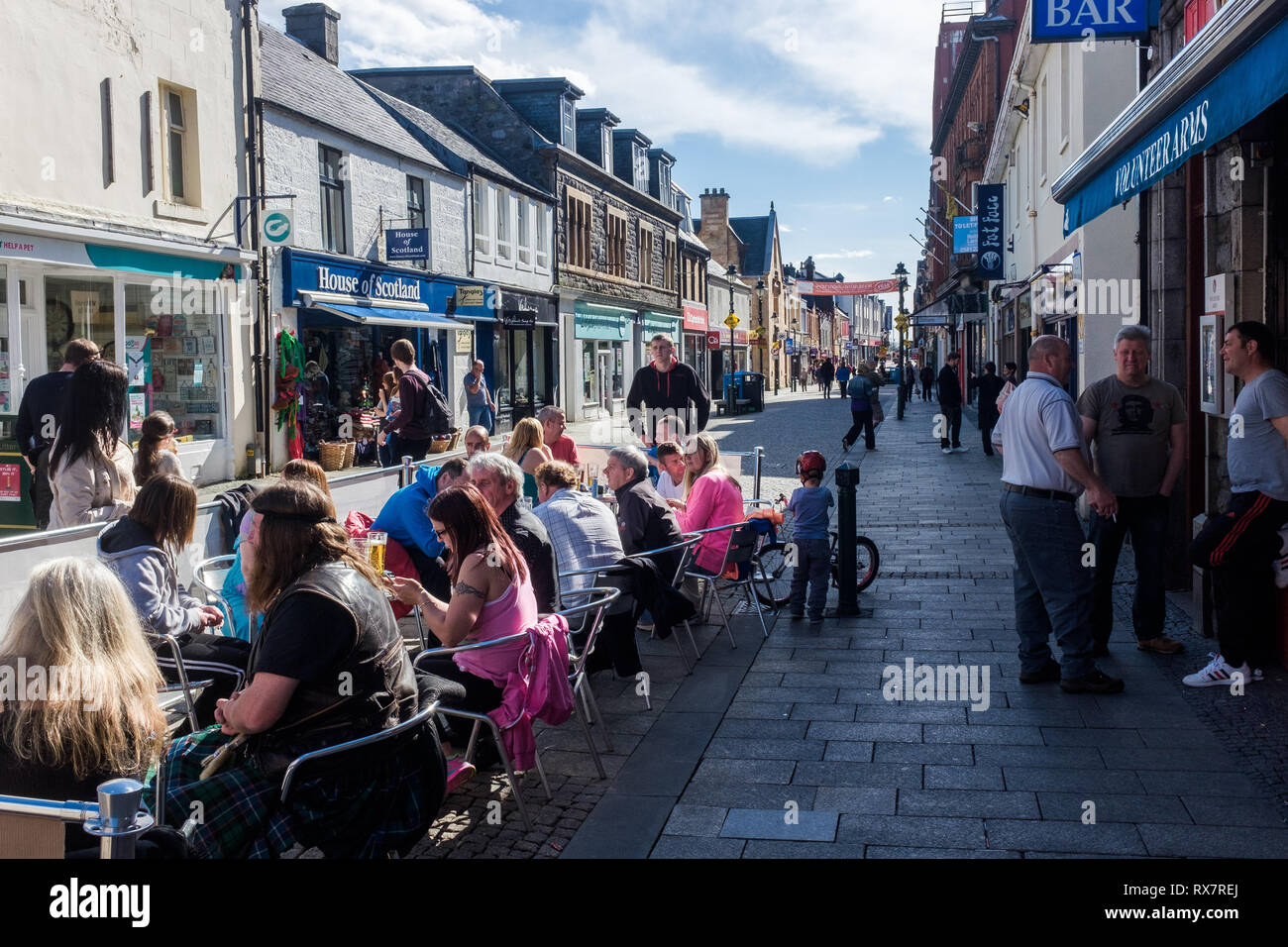 Group of people sitting outside volunteer arms bar in fort william high